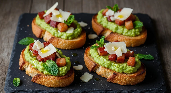 Toasted crostini topped with green broad bean and mint puree, crispy guanciale and shaved Parmigiano Reggiano.
